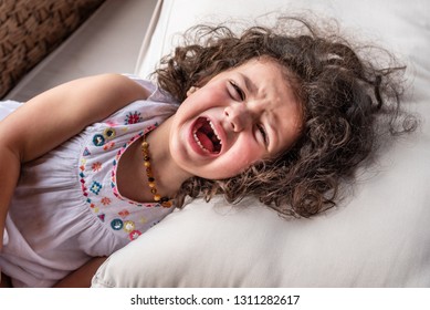 Strong screaming due to a tantrum
Yelling in a high pitch volume  - Shutterstock ID 1311282617