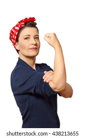 Strong and self-confident woman with a clenched fist rolling up her sleeve, icon of the american women's lib movement Rosie Riveter, isolated on white, copy space