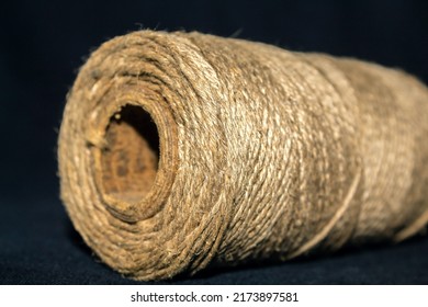 Strong thread. Weaving tool. Knitting thread. Old durable material. Spool of thread