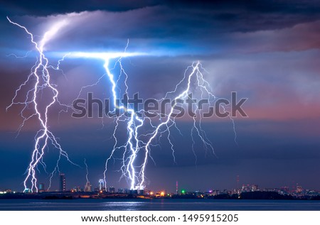 strong thunderstorm with lightning over the city