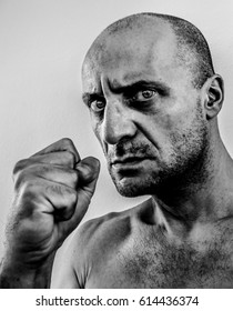 Strong, Ugly And Angry Man Shaking Fist, Bad Guy With Big Nose, Black Eye, Stony Unshaven Face, Old Boxer Dark Portrait