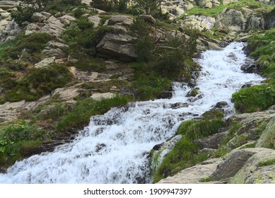 Strong water torrent running down the mountains during a summer morning (Pyrenees, Andorra). 