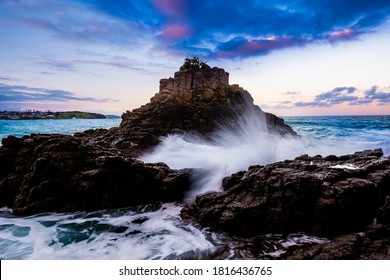 Strong Wave Crashing Rocks Along The Coast Line In Australia