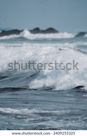 Strong waves on the ocean shore, foam, reefs