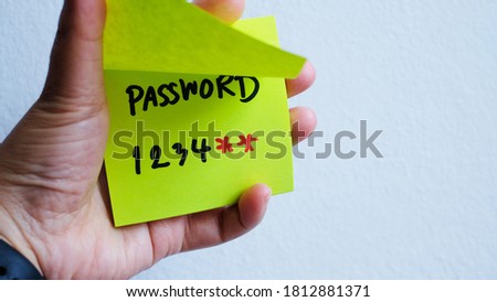 Strong and weak easy Password. Note pad and laptop.