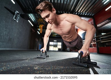 Strong Well-built Guy Working Out At Gym