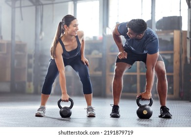 Strong, wellness couple doing kettlebell weight exercise, workout or training inside a gym. Happy sports people or trainer motivation, exercising with fitness equipment for muscle, strength or - Powered by Shutterstock