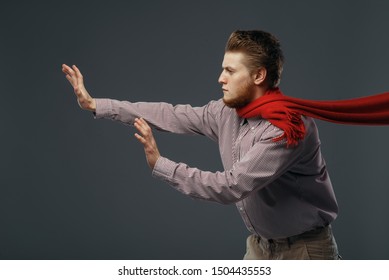 Strong Wind Blowing On Man In Red Scarf