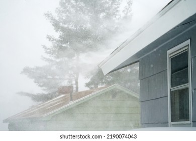 Strong Wind Blowing Snow Off The Roof In Blizzard         