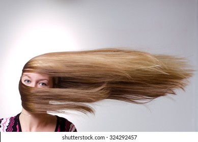 Strong Wind Blows On Woman's Hair