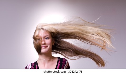 Strong Wind Blows On Woman's Hair