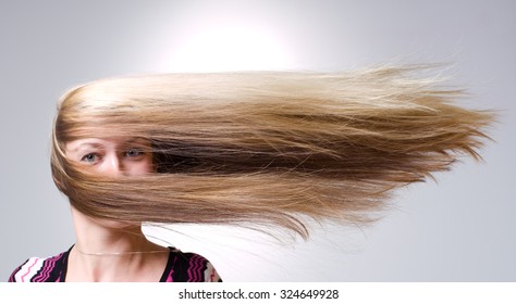 Strong Wind Blows On Woman's Hair