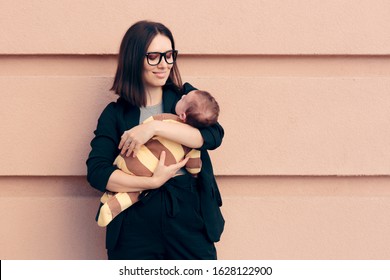 Strong Woman In Business Outfit Holding Baby. Female Role Model Being A Strong Mom And An Entrepreneur
