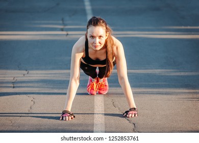 Strong Woman Doing Push Up Outdoors At Park