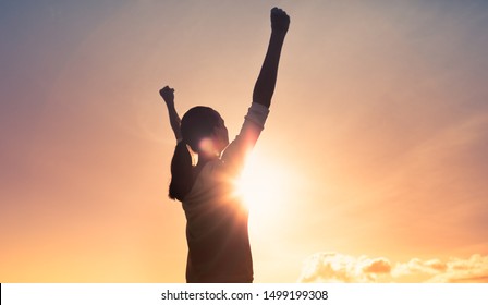 Strong woman with fist in the air. People power, and determination. 