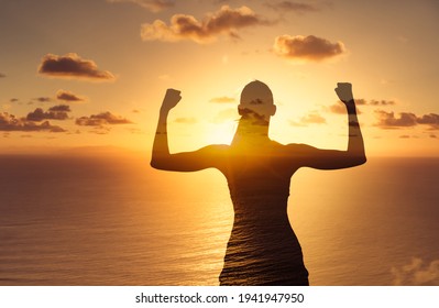 Strong Woman Flexing Facing The Horizon. Physical Power, And Mental Strength Concept. 