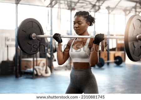 Strong, workout and barbell with black woman in gym for fitness, weightlifting and muscle. Health, challenge and exercise with female bodybuilder and weights for focus, performance and commitment