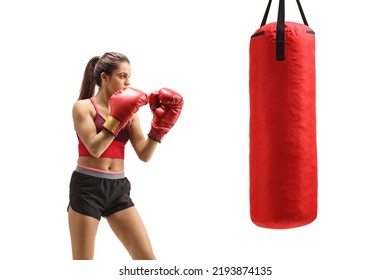 Strong young female training box with a punching bag isolated on white background - Powered by Shutterstock