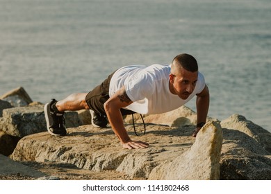 Strong Young Man Performing Pushups On Stock Photo 1141802468 ...