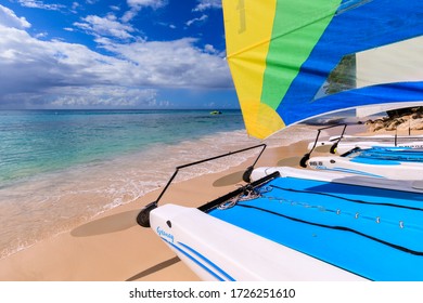 Strongly Composed View Of Section Of Sail Boats Hauled Up On A Caribbean Beach With Analogous Colors Of Blue, Yellow And Green, Platinum Coast, West Coast, St James Parish, Barbados 11.22.19 