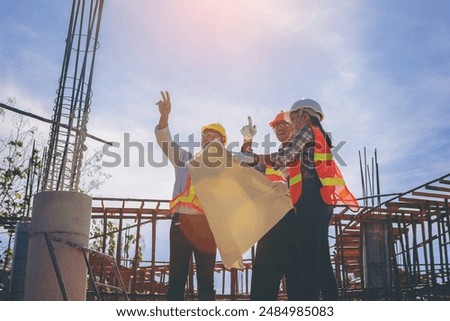 Structural engineer or architect and foreman worker with blueprints discuss, plan working for the outdoors building construction site. Construction collaboration concept