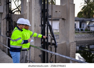 Structural engineers and technicians are rigorously inspecting the dam's floodgates to ensure they are functioning properly.