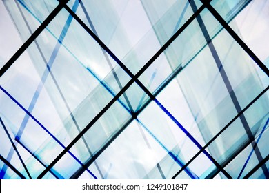 Structural Glass Wall / Ceiling And Sky Visible Through. Double Exposure Photo Of Transparent Modern Office Building Fragment. Abstract Background On The Subject Of Contemporary Architecture.