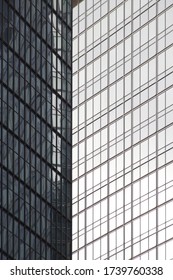 Structural glazing with recflections.  Pattern of framed windows. Abstract modern architecture. Hi-tech skyscraper building. Industrial minimalism. Glass and steel material and geometric background.