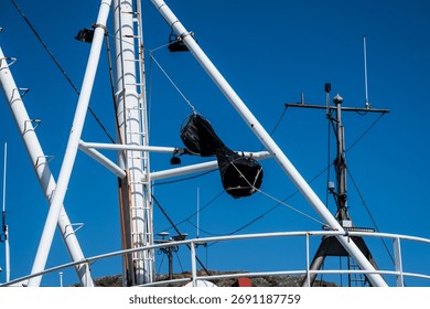 Structural rigging and radar masts on fishing boat