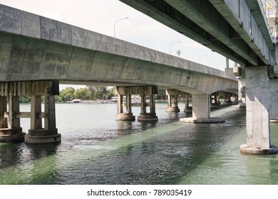 The structure of the bridge over the river.