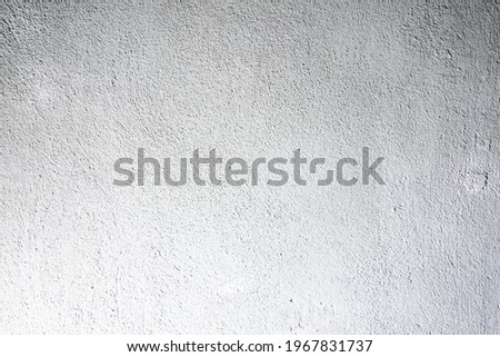 Structure of dirty white wall with dilapidated plaster. Rough white wall