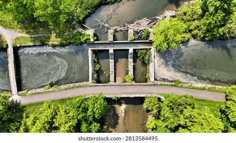 A structure to facilitate the flow of two waterways running perpendicular to one another.