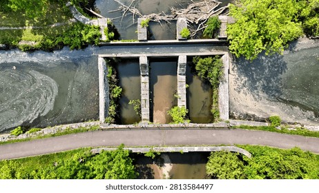 A structure to facilitate the flow of two waterways running perpendicular to one another.