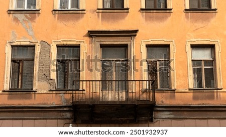 A structure featuring a balcony situated on one of its side walls