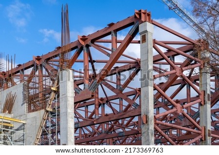 Structure of industrial building with prefabricated engineering formwork under construction. Metal base of reinforced concrete walls. Part of structure of building of reinforced concrete.
