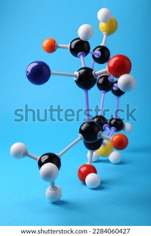 Structure of molecule on light blue background. Chemical model