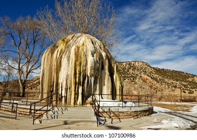 A structure shaped like a tepee was built in 1909 to vent steam from hot mineral water.  As water flows over it, the water cools and deposits layers of travertine in Thermopolis, Wyoming.