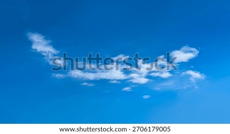 Structure of some cloud on the blue sky. White relaxed cottony form. Background serene sky. Fiber contours after rain. Lonely substance of water.