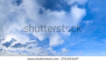 Structure of some cloud on the blue sky. White relaxed cottony form. Background serene sky. Fiber contours after rain. Lonely substance water.