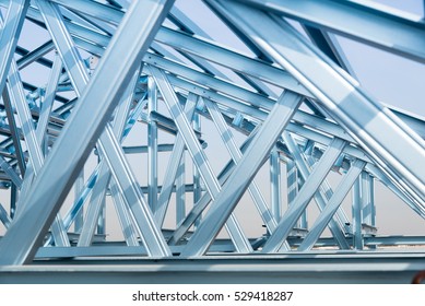 Structure Of Steel Roof Frame For Building Construction On Sky Background.