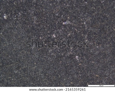 Structure of titanium under a microscope. The surface of the titanium alloy sample.