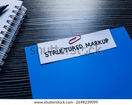 Structured markup writting on table background.
