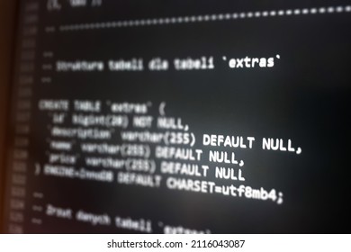 Structured Sql Code On Monitor. SQL Code On A Dark Background Development