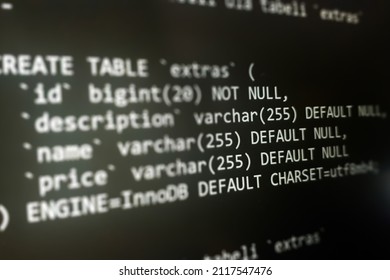 Structured Sql Code On Monitor. SQL Code On A Dark Background Development