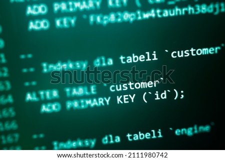 Structured sql code on monitor. SQL code on a dark background development