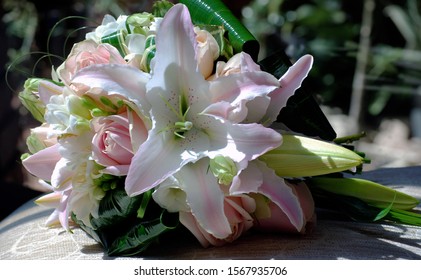 Structured Teardrop Bridal Bouquet Of Pink Oriental Lilies, Pink Roses, White Freesias And Lisianthus. Classic Wedding Flowers. 