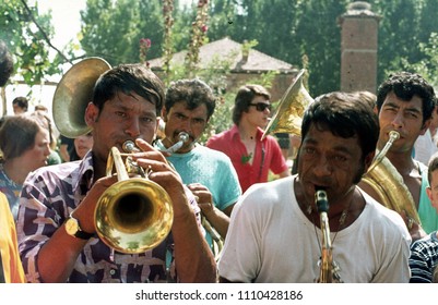 Struga, Macedonia/Yugoslavia - CIRCA 1974 : Vintage Photograph Of A Gypsy Brass Band Playing At A Local Wedding.