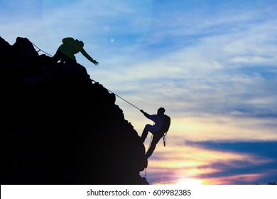 Struggle Of The Rope Climb On The Rocks