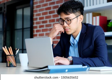 Struggling Businessman, Young Asian Office Man Struggle With Laptop Computer, Frustrated Asian Business Man Looking At Computer While Working At Office, Business People Struggle With Technology 