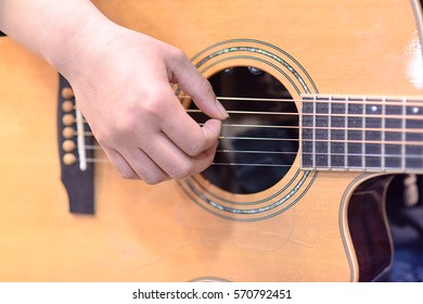 Strum The Guitar With The Right Hand